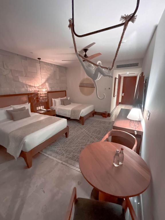 Postel nebo postele na pokoji v ubytování Hotel Mundo Maya Calakmul