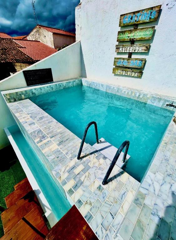 a swimming pool in the backyard of a house at Mouradia Safara in Safara