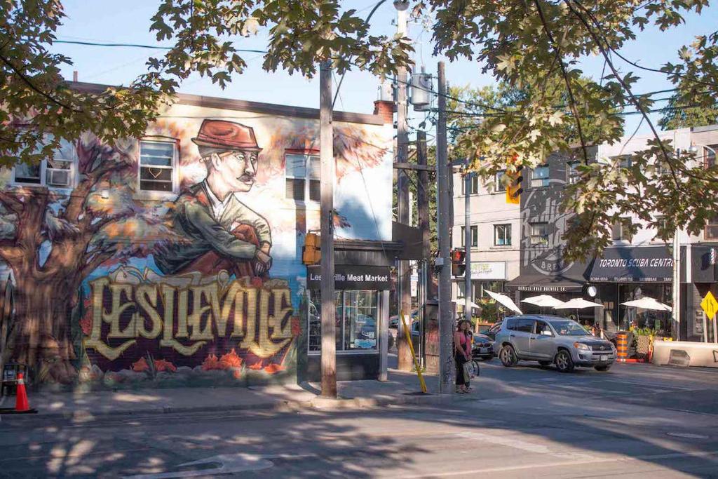 a mural on the side of a building on a street at Casa Hotel Elegant 2BR Suite in Leslieville in Toronto