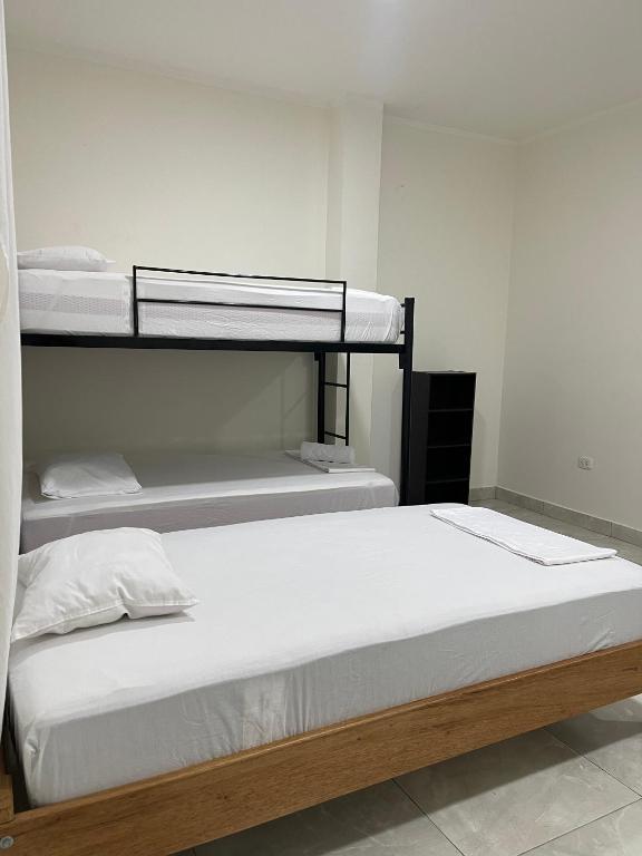 Postel nebo postele na pokoji v ubytování Iquitos House