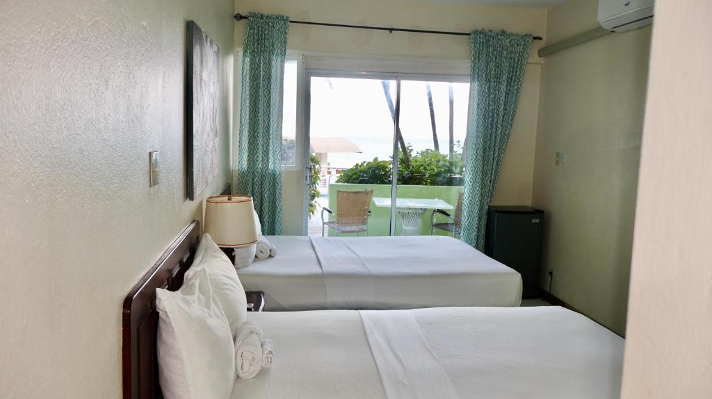 Voodi või voodid majutusasutuse Ocean Palms toas