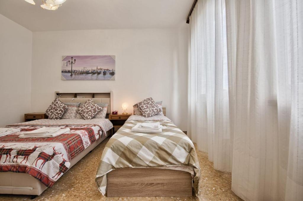 Postel nebo postele na pokoji v ubytování Urban Apt Neighbour Venice