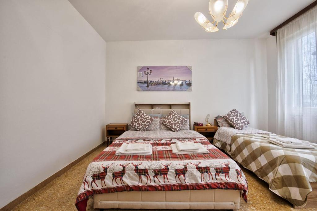 Postel nebo postele na pokoji v ubytování Urban Apt Neighbour Venice