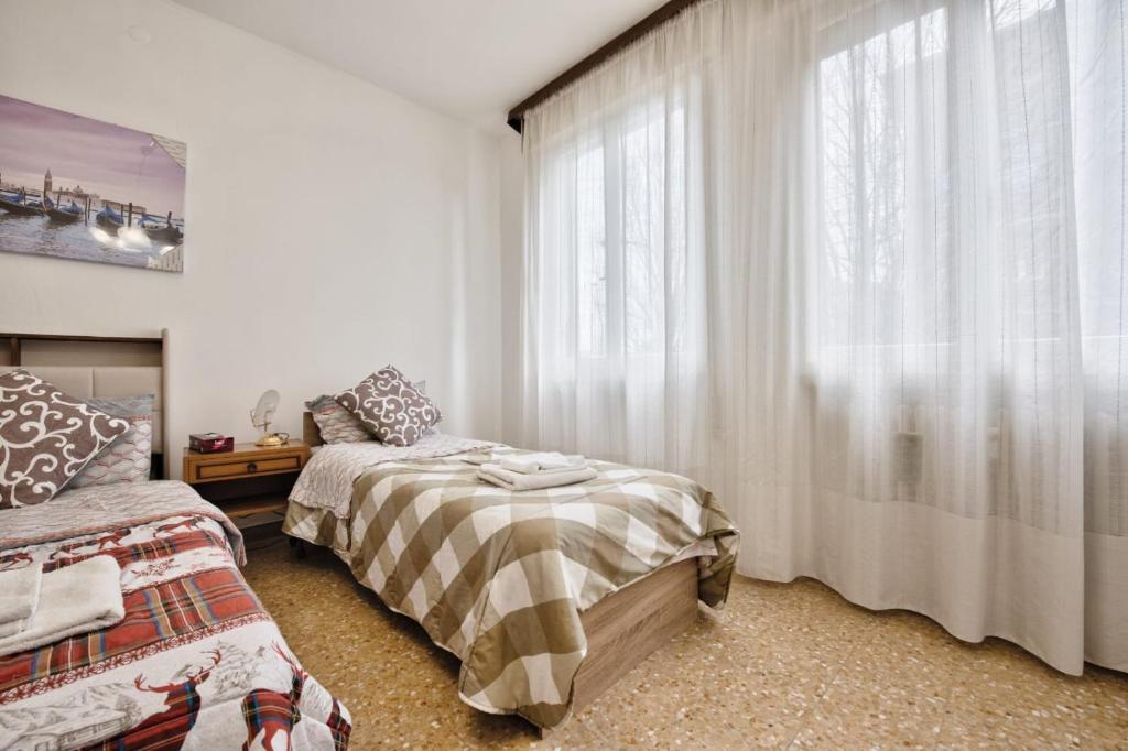Postel nebo postele na pokoji v ubytování Urban Apt Neighbour Venice