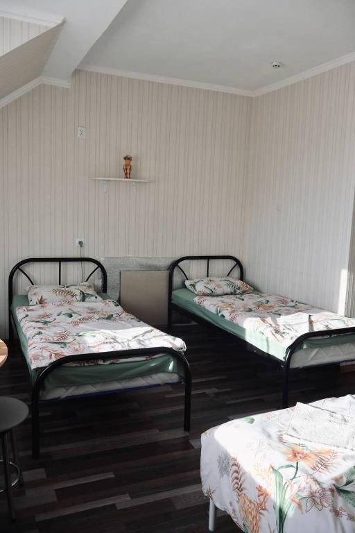 Postel nebo postele na pokoji v ubytování VIP hotel