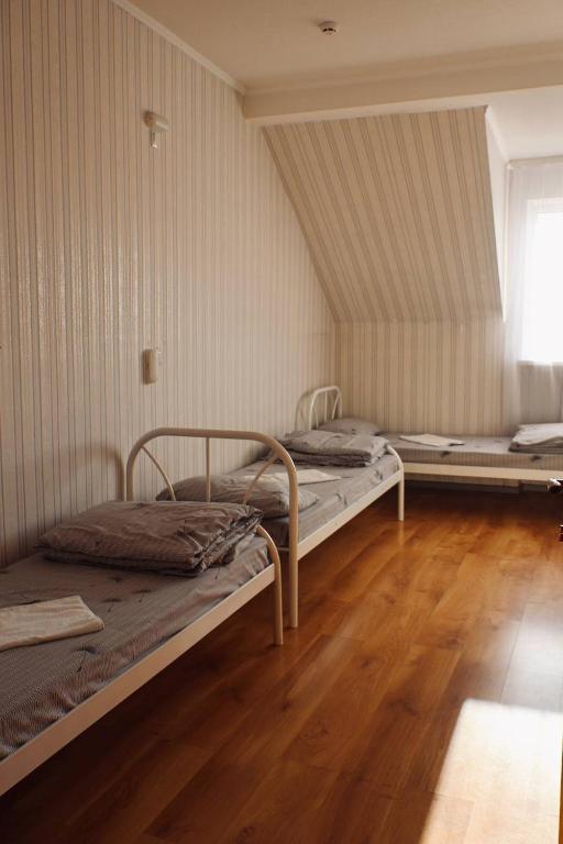 Postel nebo postele na pokoji v ubytování VIP hotel