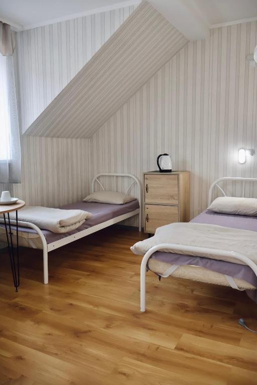 Postel nebo postele na pokoji v ubytování VIP hotel
