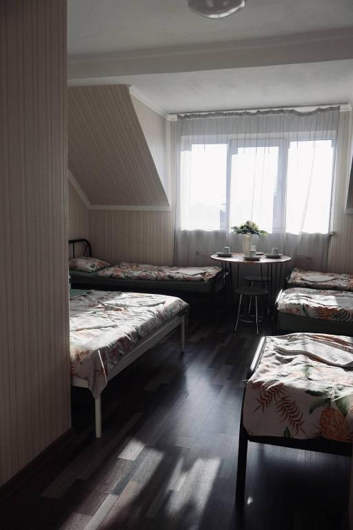 Postel nebo postele na pokoji v ubytování VIP hostel