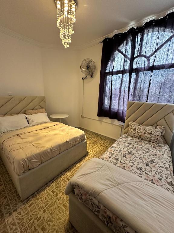 Postel nebo postele na pokoji v ubytování International Abu-Dhabi Hostel Villa
