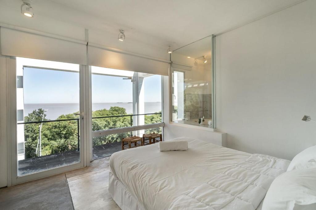 Ένα ή περισσότερα κρεβάτια σε δωμάτιο στο Espectacular Casa con vistas panorámicas y WIFI