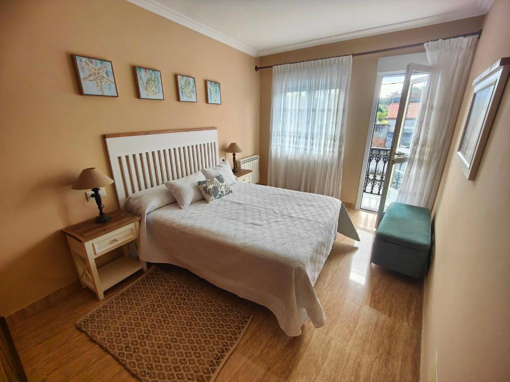 Ένα ή περισσότερα κρεβάτια σε δωμάτιο στο Piso Porto Meloxo O Grove