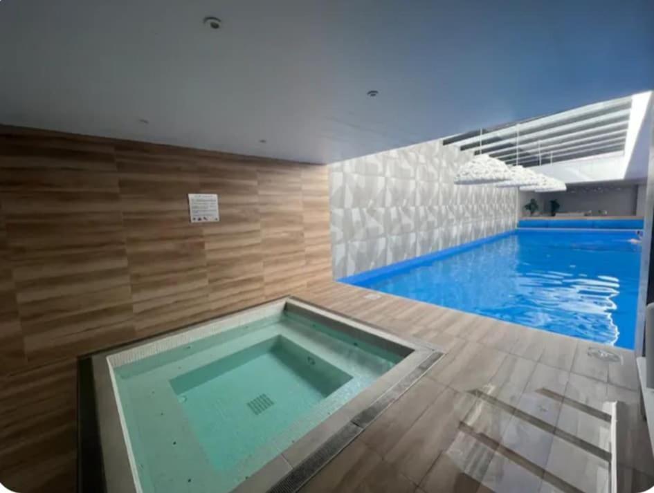 Bazén v ubytování Lovely View Studio Building Heated Pool Gym Turco WIFI nebo v jeho okolí