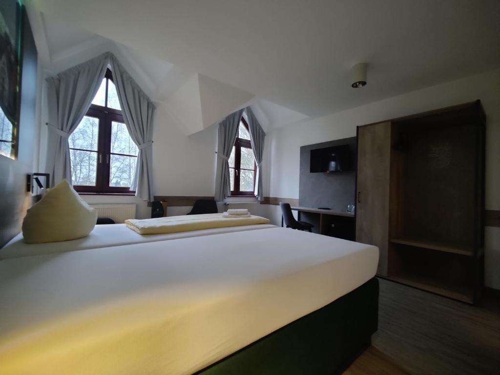 Postel nebo postele na pokoji v ubytování Hotel Stettiner Hof