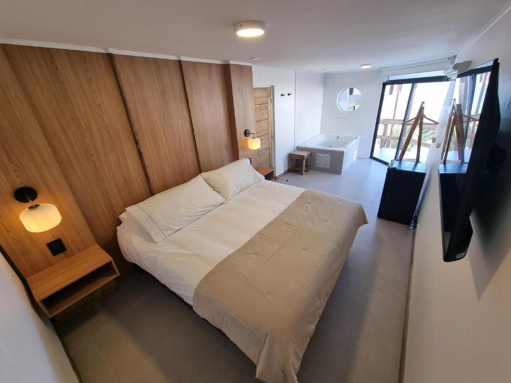 Postel nebo postele na pokoji v ubytování Maré Hotel Boutique