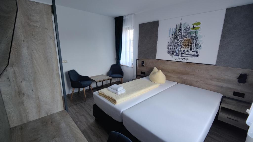 Postel nebo postele na pokoji v ubytování Hotel Stettiner Hof