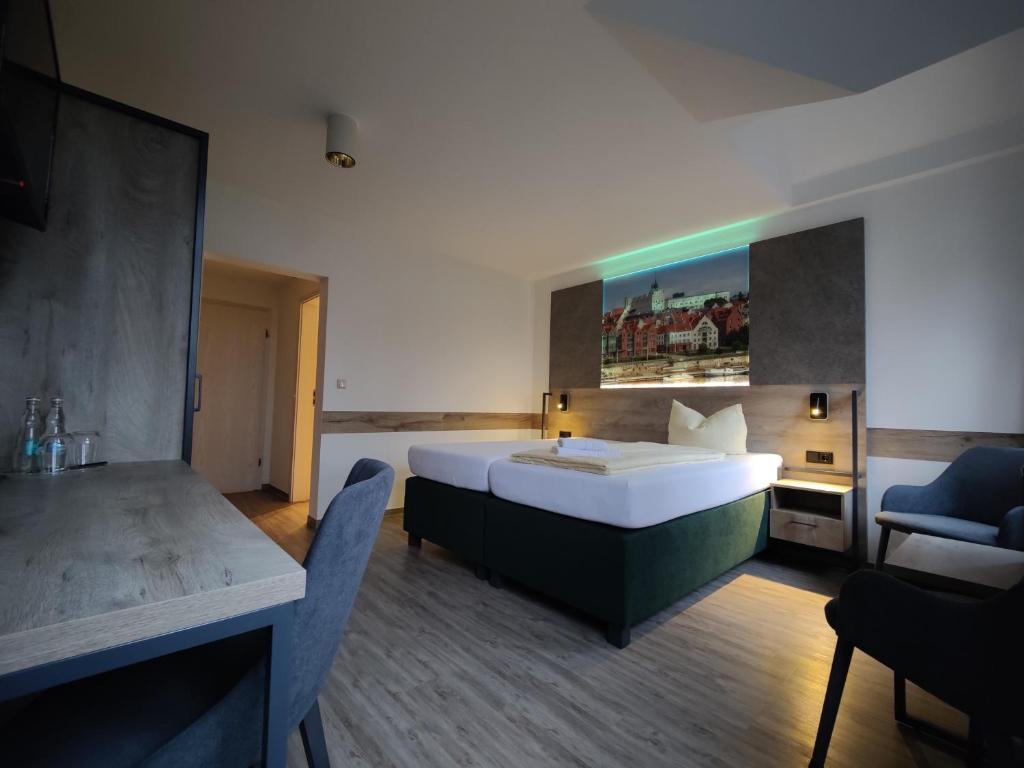 Postel nebo postele na pokoji v ubytování Hotel Stettiner Hof