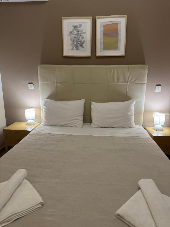 Łóżko lub łóżka w pokoju w obiekcie Antonia Apartments