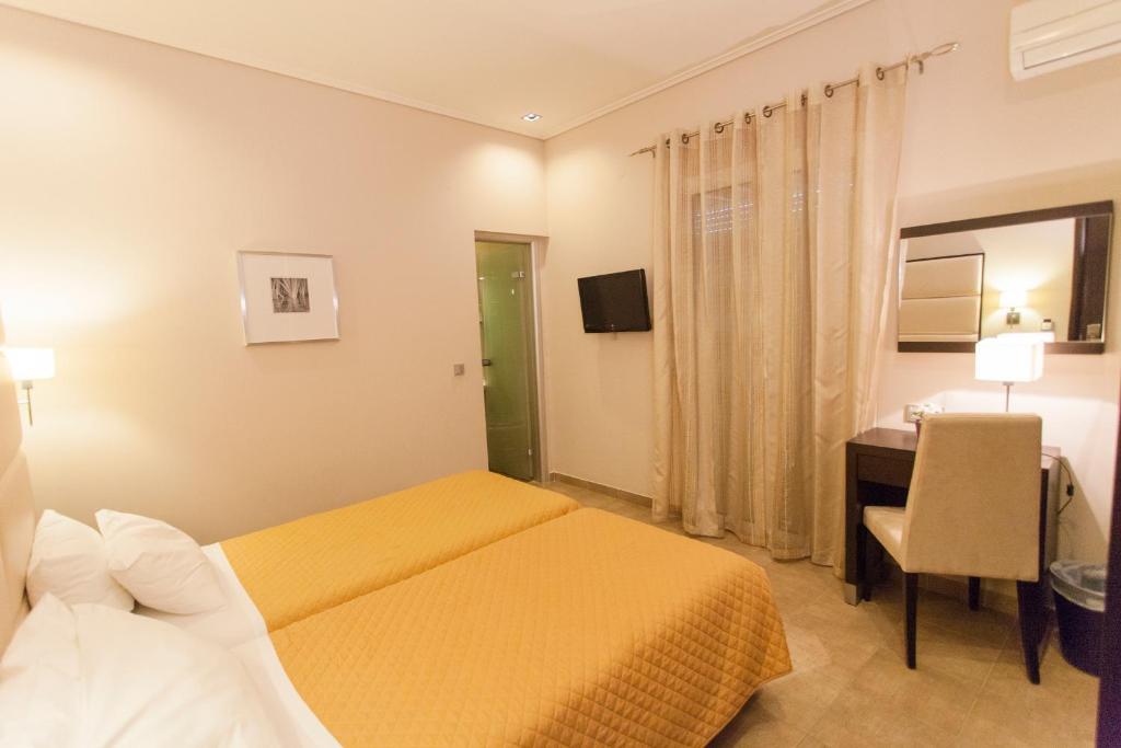 Postel nebo postele na pokoji v ubytování Hotel Aheron