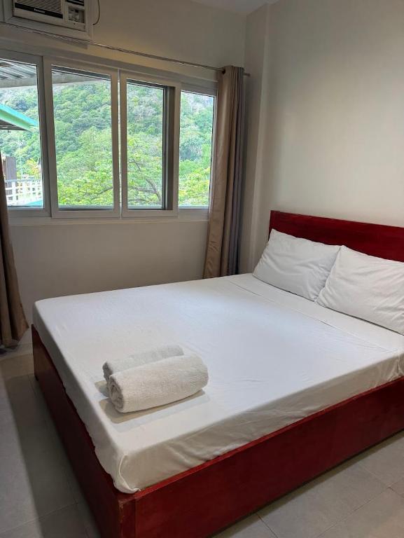 Postel nebo postele na pokoji v ubytování Lakandiwa Tourist Inn