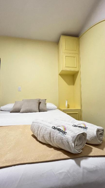 Postel nebo postele na pokoji v ubytování Hotel Chromatic