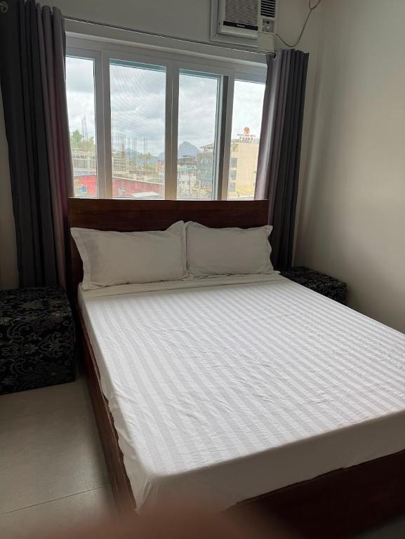 Postel nebo postele na pokoji v ubytování Lakandiwa Tourist Inn