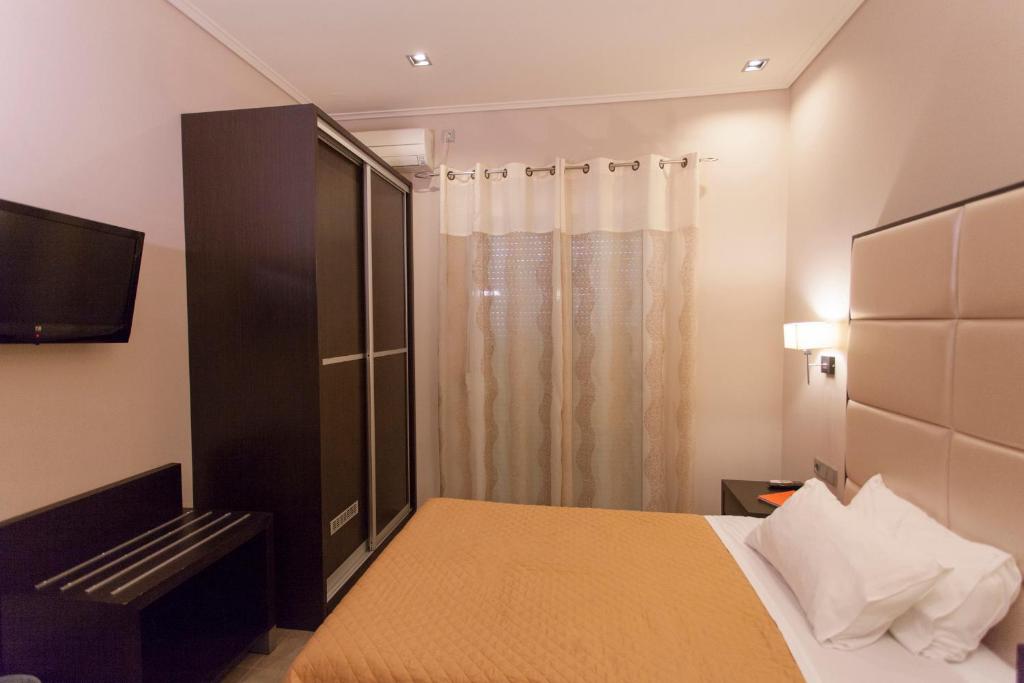 Postel nebo postele na pokoji v ubytování Hotel Aheron