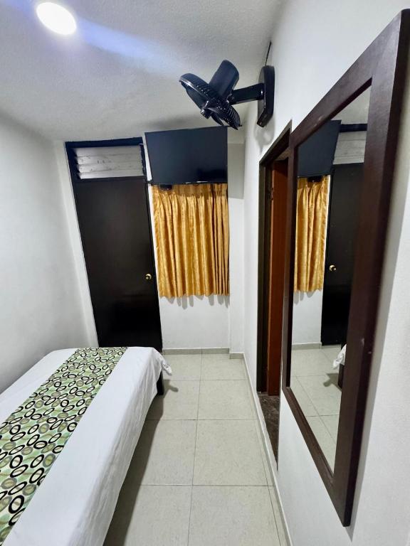 Postel nebo postele na pokoji v ubytování Hotel Tucan Pereira