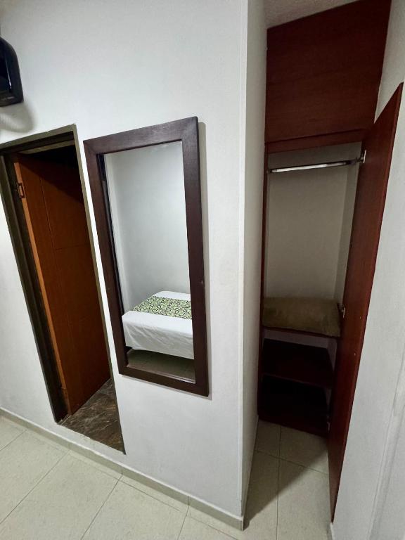 Postel nebo postele na pokoji v ubytování Hotel Tucan Pereira