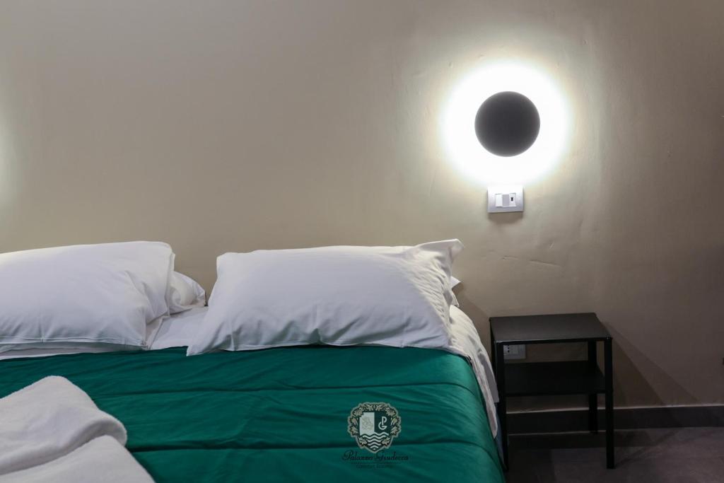 Postel nebo postele na pokoji v ubytování Palazzo Giudecca