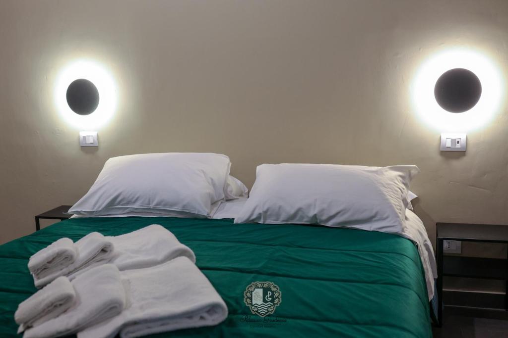 Postel nebo postele na pokoji v ubytování Palazzo Giudecca