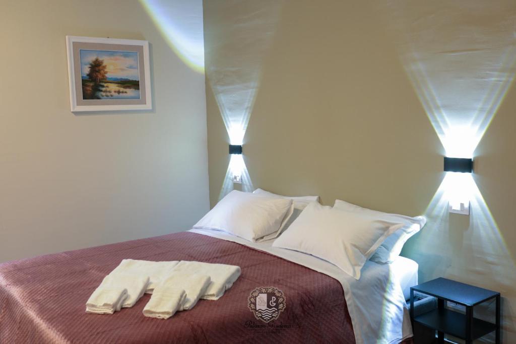 Postel nebo postele na pokoji v ubytování Palazzo Giudecca