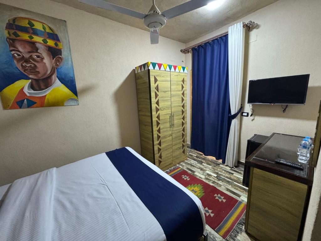 Postel nebo postele na pokoji v ubytování ACHERTOD Nubian House