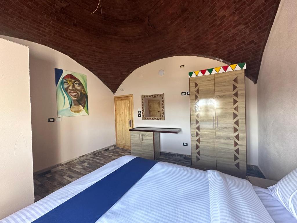 Postel nebo postele na pokoji v ubytování ACHERTOD Nubian House