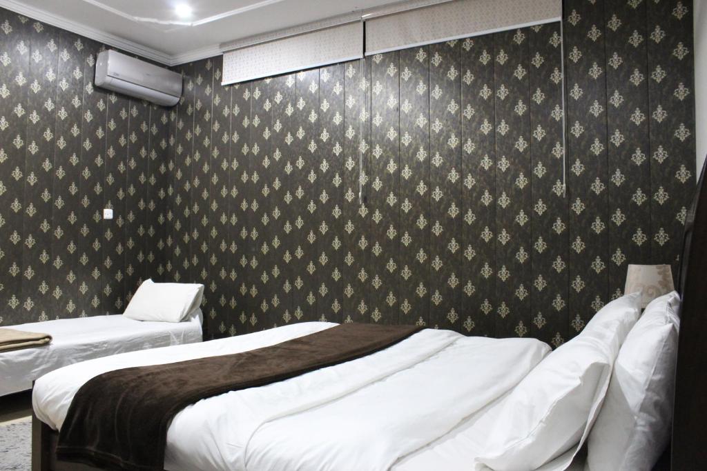 Ένα ή περισσότερα κρεβάτια σε δωμάτιο στο Doolv Guest Houses