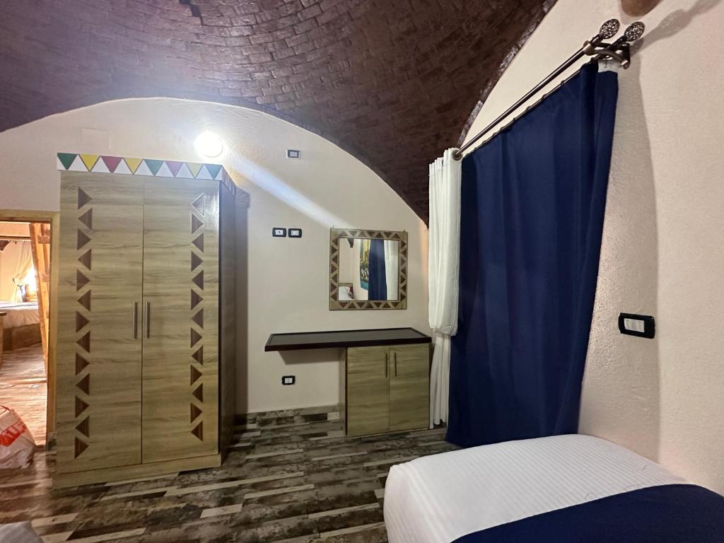 Postel nebo postele na pokoji v ubytování ACHERTOD Nubian House