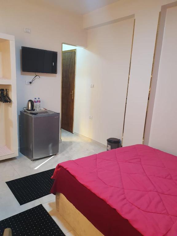 Katil atau katil-katil dalam bilik di Zein Pyramids View - Guest House
