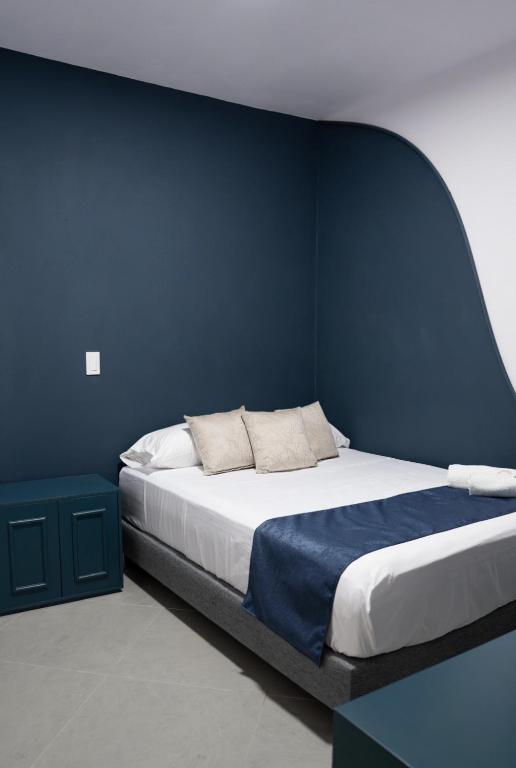 Postel nebo postele na pokoji v ubytování Hotel Chromatic