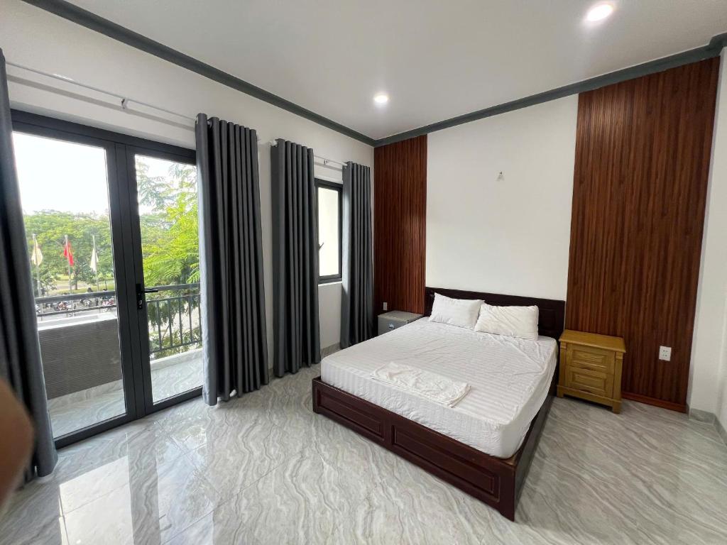 Postel nebo postele na pokoji v ubytování Homestay HOA SEN K1 PHAN RANG