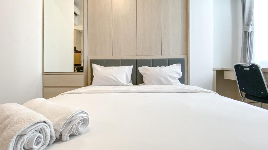 Ένα ή περισσότερα κρεβάτια σε δωμάτιο στο Relaxing Studio at Tokyo Riverside PIK 2 Apartment By Travelio
