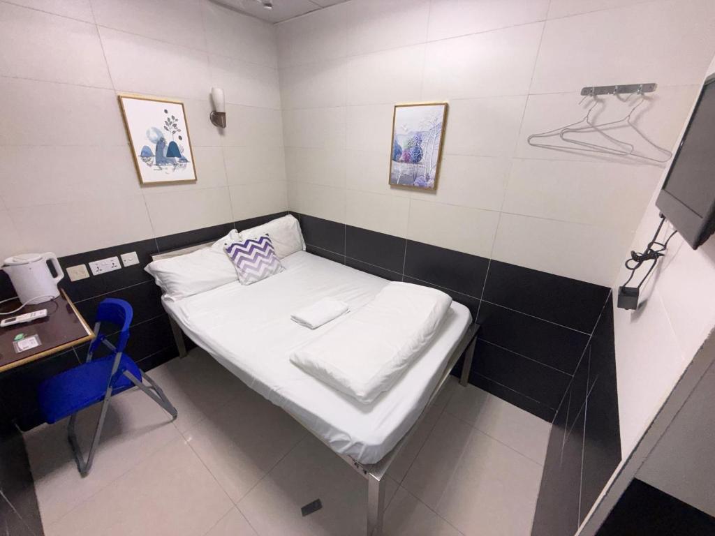 Letto o letti in una camera di Apple Hostel 蘋果賓館