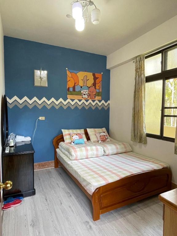 Postel nebo postele na pokoji v ubytování Ya Yuan Homestay