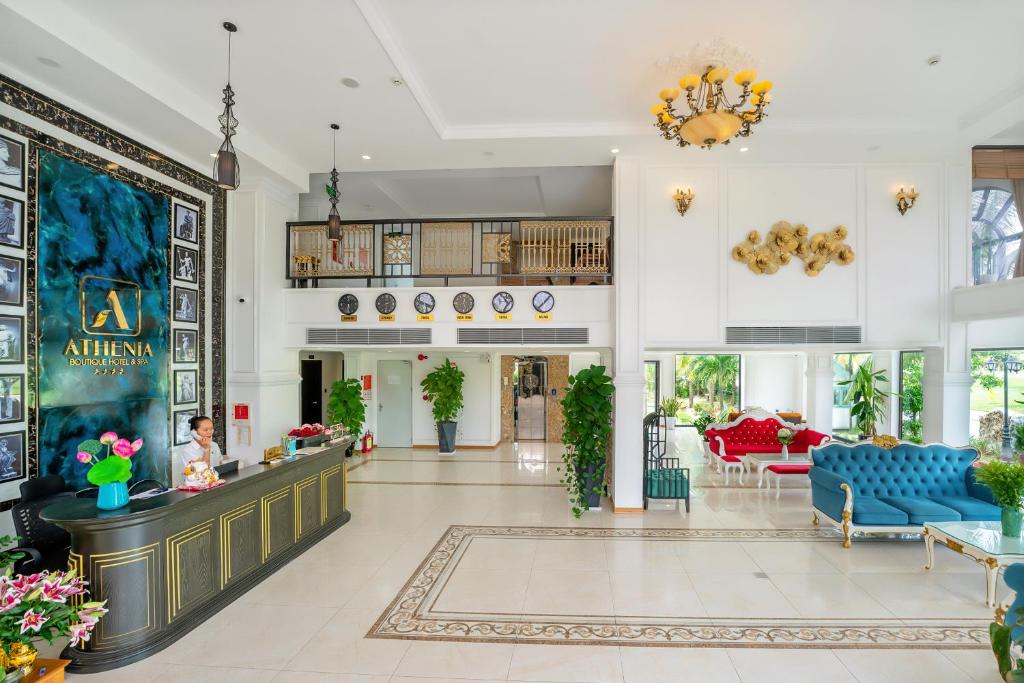 a lobby of a hotel with blue furniture at Athenia Hoi An Boutique Hotel & Spa in Hoi An