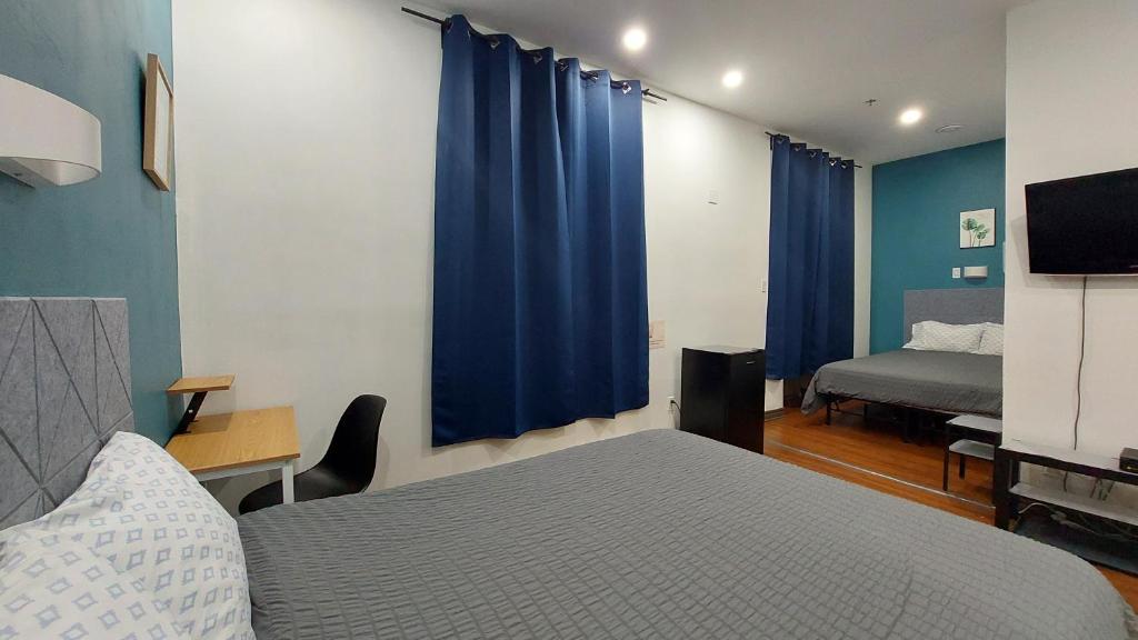Postel nebo postele na pokoji v ubytování APD HOTEL