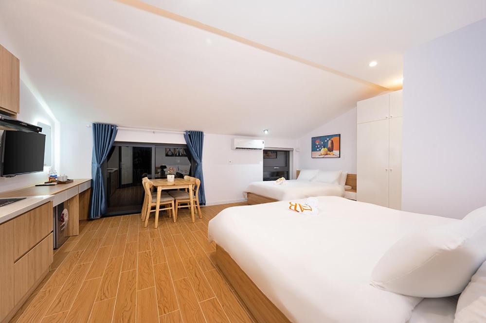 Postel nebo postele na pokoji v ubytování An Bang Spa & Apartment