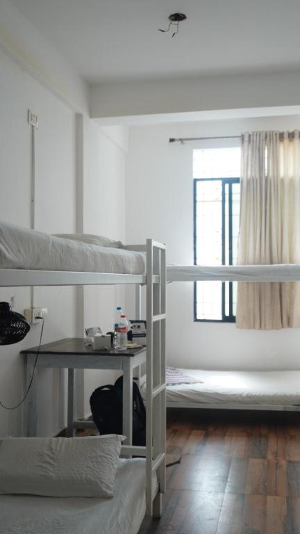 Cama o camas de una habitación en This is it Beachfront - Rooms, Cafe & Events