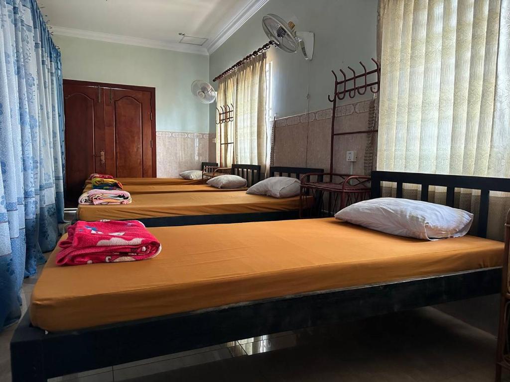 Postel nebo postele na pokoji v ubytování Eco-Home Siem Reap Homestay