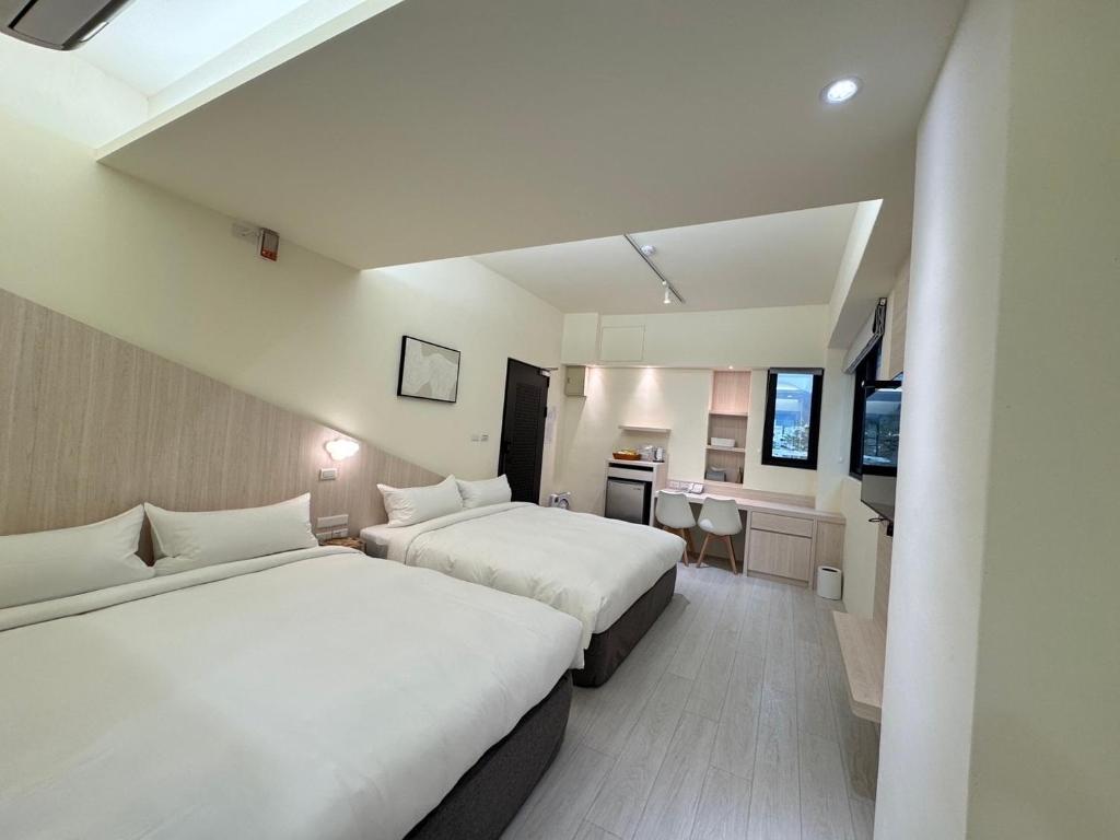 Postel nebo postele na pokoji v ubytování Yin Yun Slow Travel B&B 吟雲慢旅