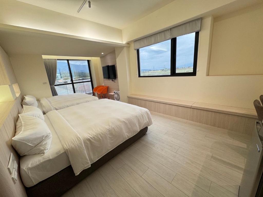 Postel nebo postele na pokoji v ubytování Yin Yun Slow Travel B&B 吟雲慢旅