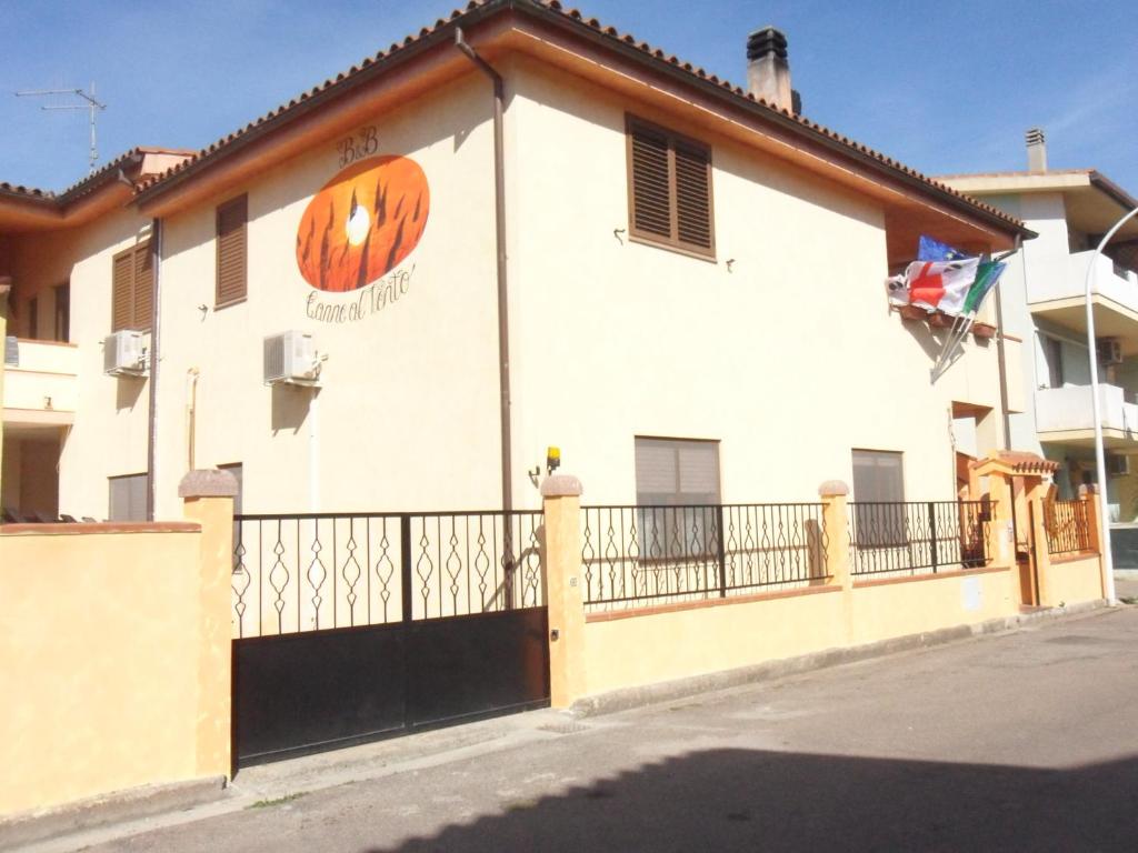 a building with a pumpkin painted on the side of it at B&B Canne al vento in Muravera
