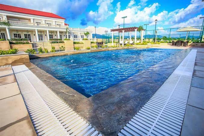 a swimming pool in front of a building at 4bhk-Villa at dlf valley township Panchkula in Panchkula